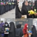 Ladies offer flowers to hijab-clad students outside Kashmir University