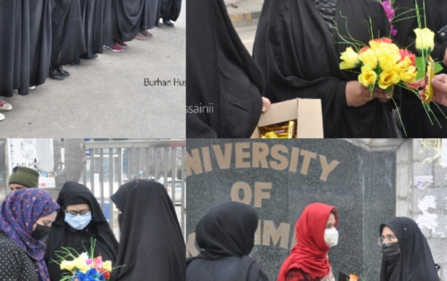 Ladies offer flowers to hijab-clad students outside Kashmir University